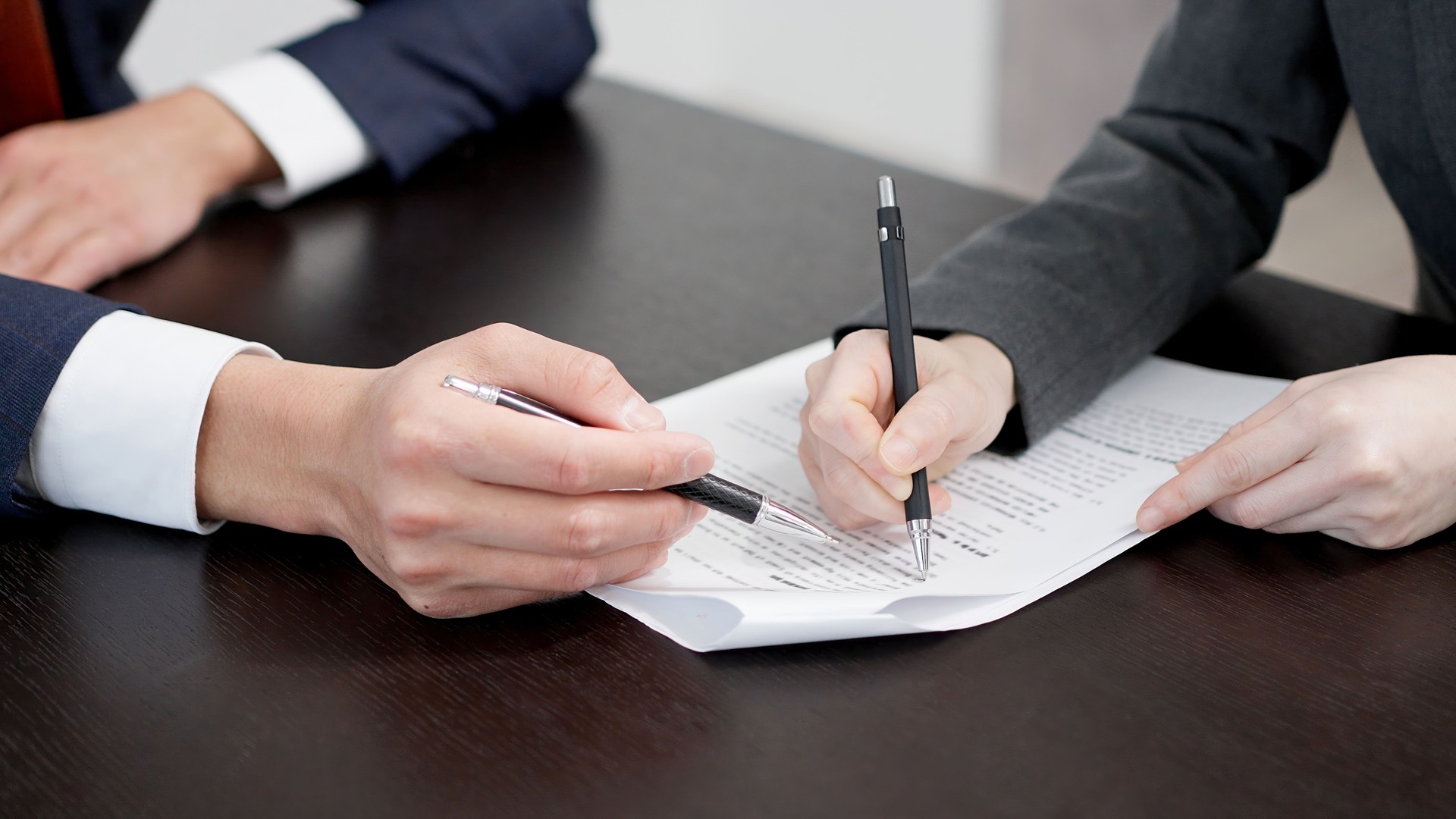 Businesswoman's hands checking a contract